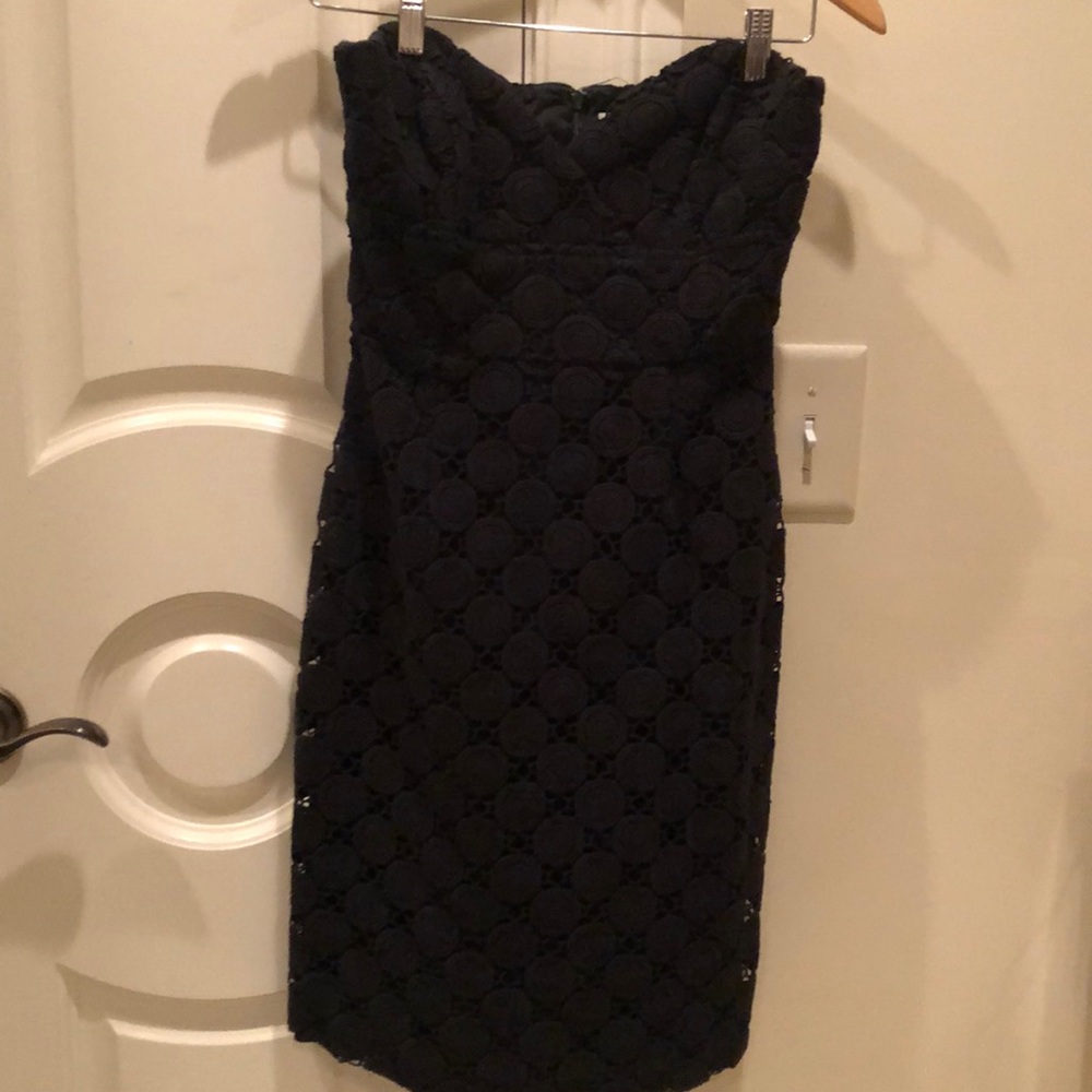 Black fitted style top short dress.